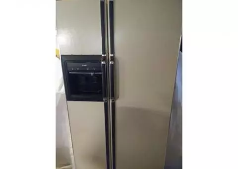 double sided kenmore refridigator with built in ice maker and water despencer.